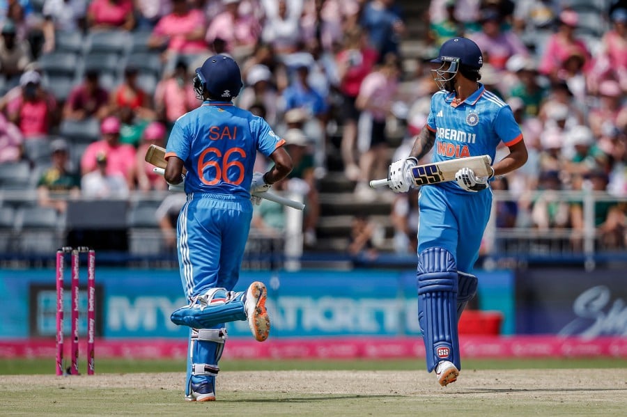 India's Sai Sudharsan (L) and Tilak Varma (R) run between wickets to win the match during the 1st ODI cricket match between South Africa and India at The Wanderers Stadium in Johannesburg on December 17, 2023. AFP PIC