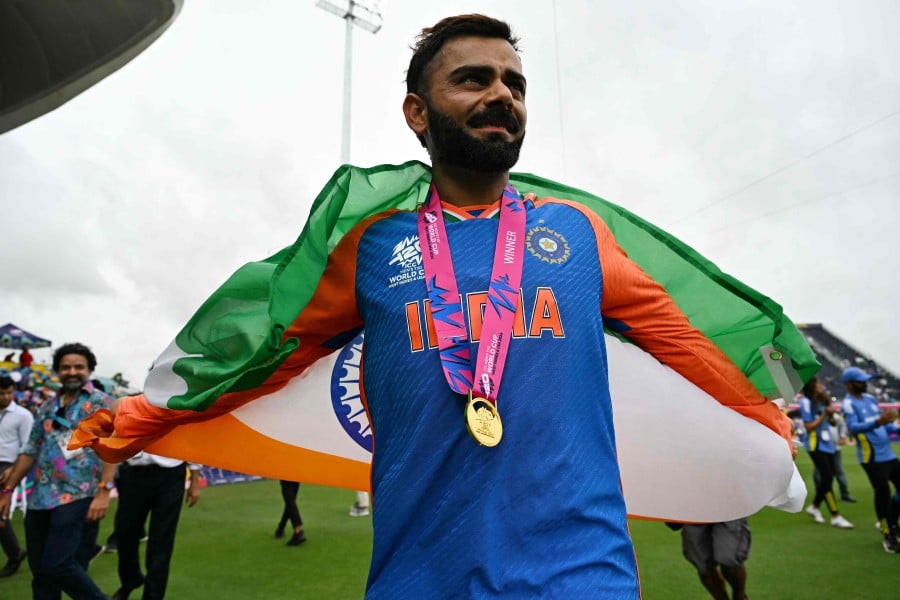 India's Virat Kohli celebrates with the trophy after winning the ICC men's Twenty20 World Cup 2024 final cricket match between India and South Africa at Kensington Oval in Bridgetown, Barbados, on June 29, 2024. AFP PIC