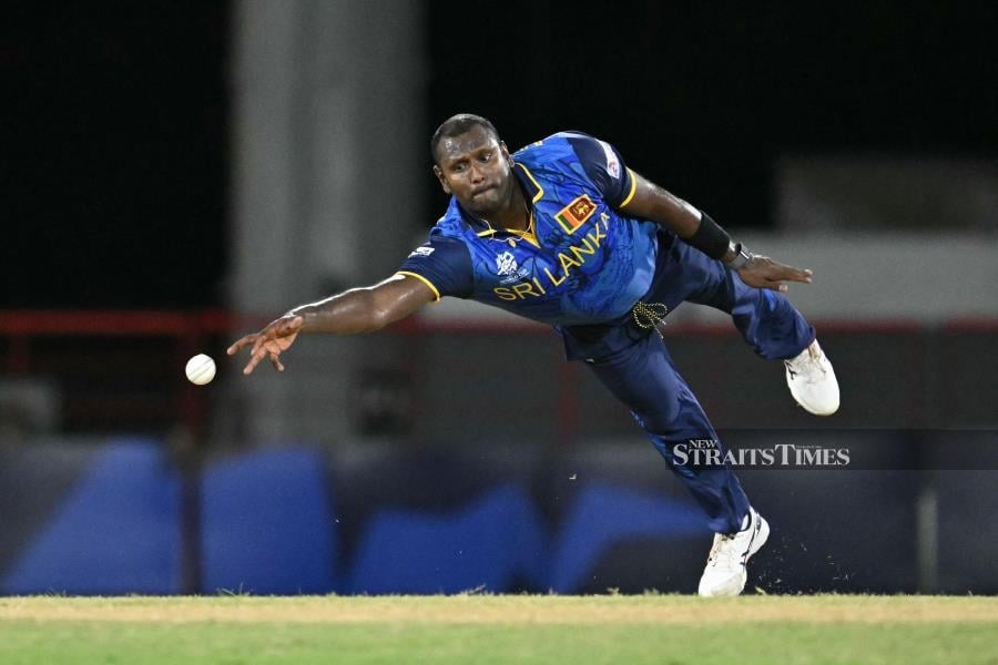 Sri Lanka's Angelo Mathews fails to catch the ball during the men's T20 World Cup Group D match against the Netherlands at Daren Sammy Cricket Ground in Gros Islet, St. Lucia, on Sunday. AFP PIC