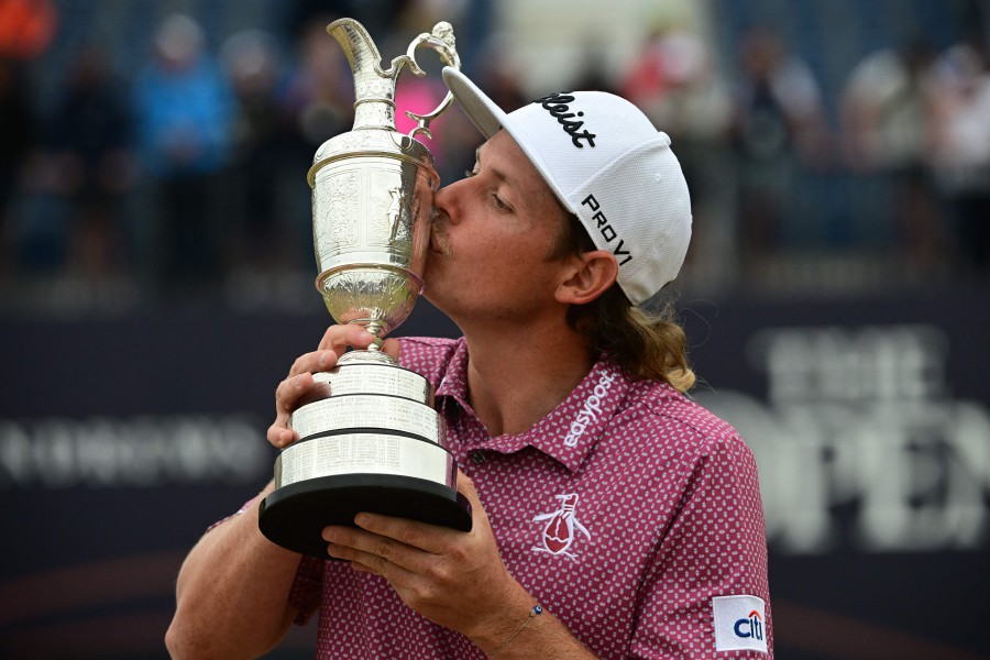 Australia's Cameron Smith kisses the Claret Jug, the trophy for the Champion golfer of the year after winning the 150th British Open Golf Championship on The Old Course at St Andrews in Scotland. - AFP PIC