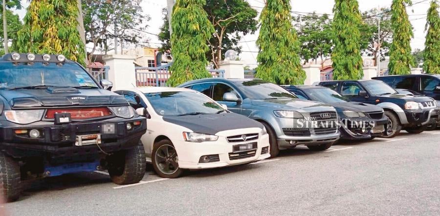 Several ‘kereta piang’ (cars repossessed in a loan takeover) seized for investigation in Jitra, Kedah. FILE PIC 