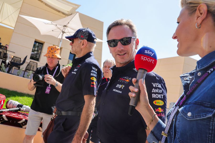 Red Bull Racing team principal Christian Horner (C) speaks to a reporter as he arrives at the Bahrain International Circuit ahead of the first practice session of the Bahrain Formula One Grand Prix in Sakhir on February 29. - AFP PIC