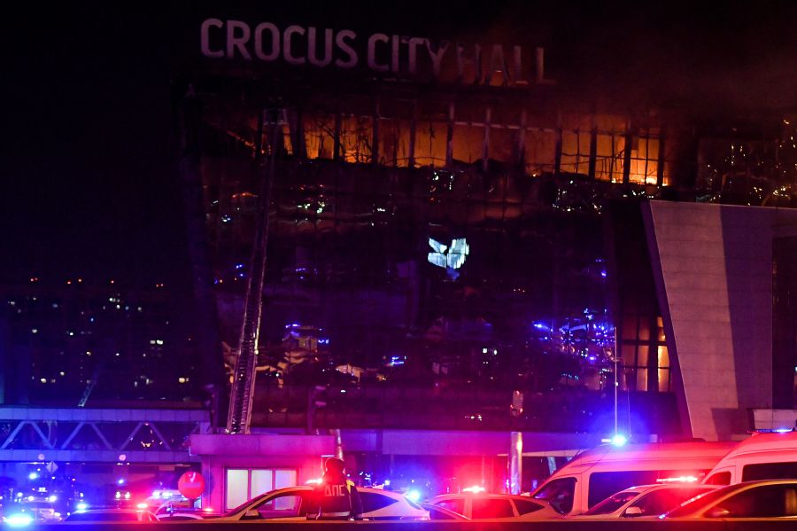Emergency services vehicles are seen outside the burning Crocus City Hall concert hall following the shooting incident in Krasnogorsk, outside Moscow. Gunmen opened fire at a concert hall in a Moscow suburb on March 22, 2024 leaving dead and wounded before a major fire spread through the building, Moscow's mayor and Russian news agencies reported. - AFP pic