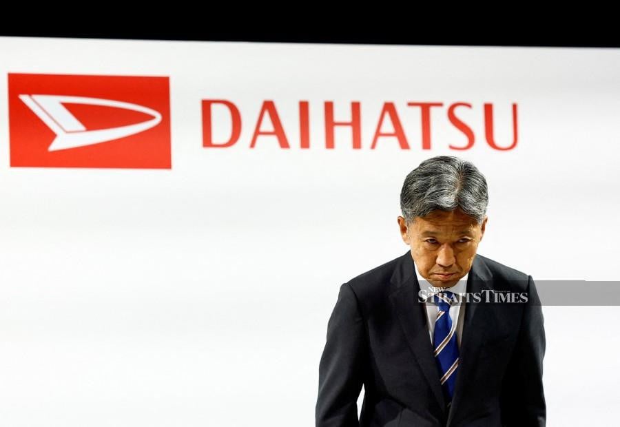 Daihatsu Motor Co.'s next President Masahiro Inoue bows as he attends a joint press conference with Toyota Motor Corp. President Koji Sato (not in picture) in Tokyo, Japan February 13, 2024.  REUTERS/Issei Kato