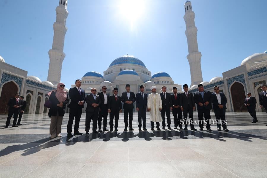  Prime Minister Datuk Seri Anwar Ibrahim (centre) take a photo with Chief Mufti of the mosque Nauryzbai Taganuly Optenov and delegates during his visiting the Astana Grand Mosque located along the historic Silk Route, today. 