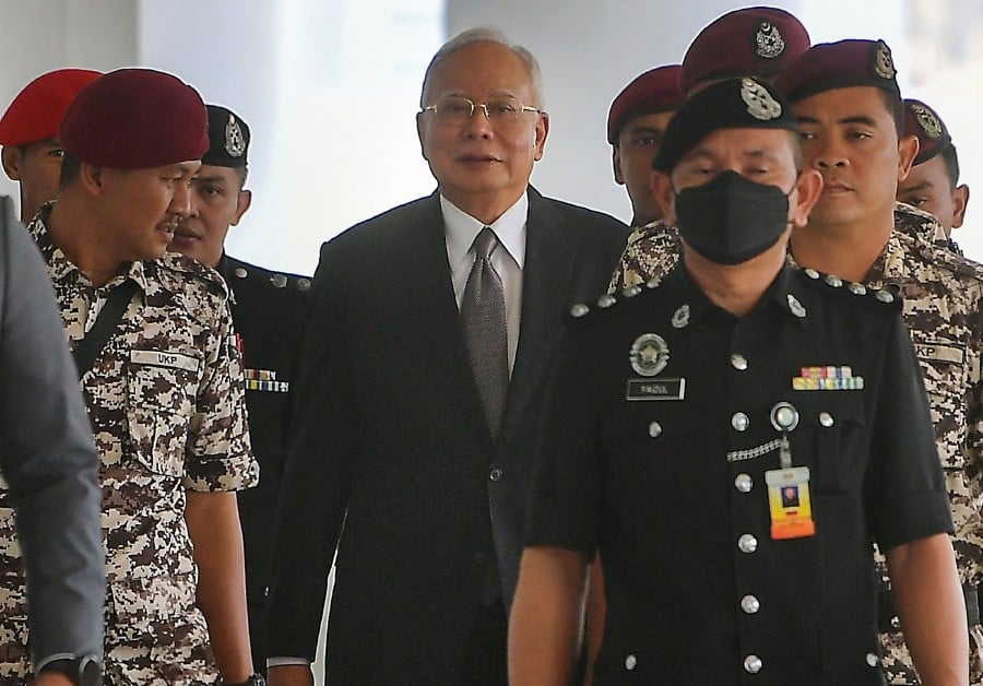 Former Prime Minister Datuk Seri Najib Tun Razak (center) attends the trial of the 1Malaysia Development Berhad (1MDB) case at the High Court. BERNAMA PIC