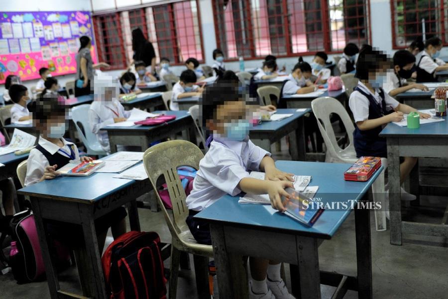 Parental groups want the Education Ministry to fully review the Dual Language Programme (DLP) following the recent change in its requirement, which has sparked protests from parents. - NSTP file pic