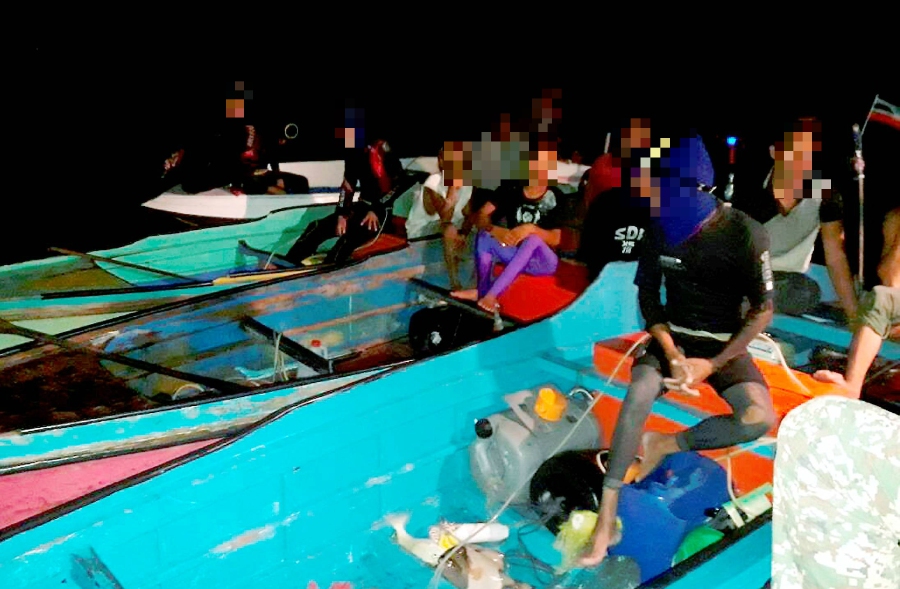 Thirty-four men travelling in seven boats have been detained by the Armed Forces' Joint Task Force 2 (ATB 2) last night while trying to enter the country illegally. Pix courtesy of Armed Forces