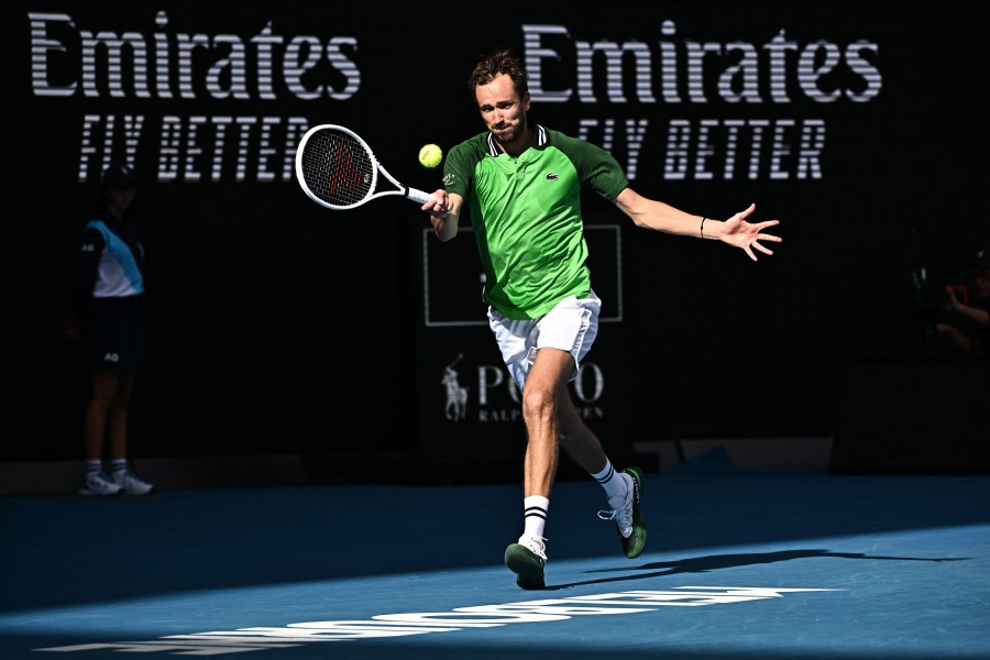 Russia's Daniil Medvedev returns to Poland's Hubert Hurkacz during their men's singles quarter-final match on day 11 of the Australian Open tennis tournament in Melbourne. - AFP pic
