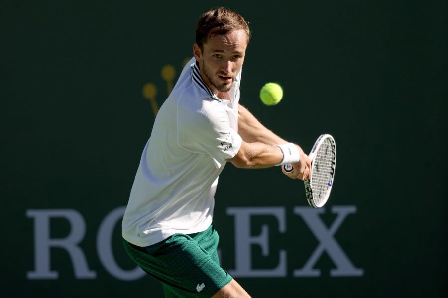 Daniil Medvedev of Russia returns a shot to Grigor Dimitrov of Bulgaria during the BNP Paribas Open at the Indian Wells Tennis Garden in Indian Wells, California. - AFP PIC