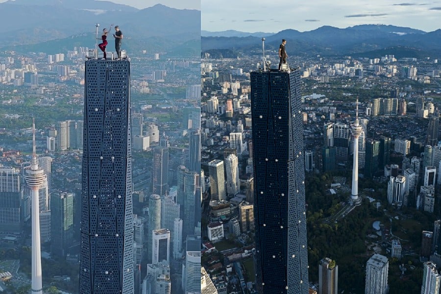 Daredevil couple climb to the top of Merdeka 118 tower