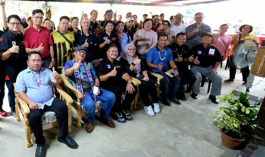 Sabah Assistant Tourism, Culture and Environment Minister Datuk Joniston Bangkuai and Kota Belud MP Innaraisah Munira Majlis (seated 2nd and 3rd left) with Nabalu Tourism Association president Michael Liman (seated, centre) giving the thumbs up to Capernaum Garden. - Pic courtesy of the Sabah Tourism Board.