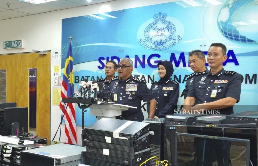 Bukit Aman Commercial Crime Investigation Department (CCID) director, Datuk Seri Ramli Mohamed Yoosuf said the detained individuals, aged 53 and 57, were believed to be the masterminds behind the syndicate. STU/FARHAN RAZAK