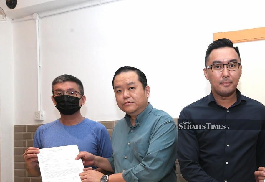 Loh Seow Hwa (left) with Federal Territory PKR Public Services and Complaints Bureau deputy chief Deric Teh (centre) and Malaysia International Humanitarian Organisation Public Relations Officer Daniel Khoo during a press conference in Petaling Jaya. -NSTP/AMIRUDIN SAHIB.
