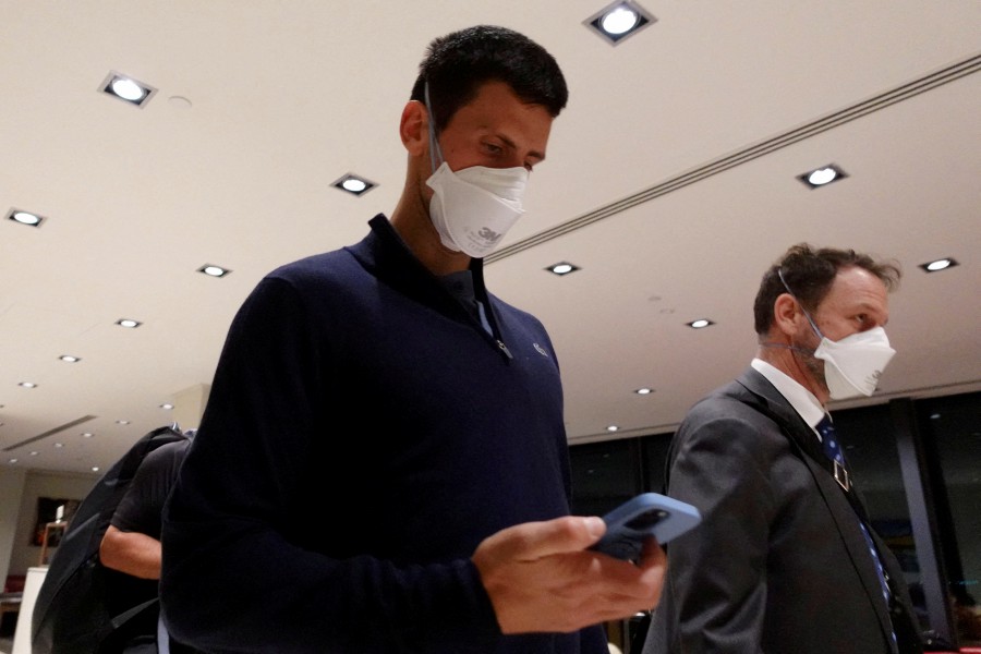 Serbian tennis player Novak Djokovic walks in Melbourne Airport before boarding a flight, after the Federal Court upheld a government decision to cancel his visa to play in the Australian Open, in Melbourne, Australia on January 16, 2022. -REUTERS FILE PIC