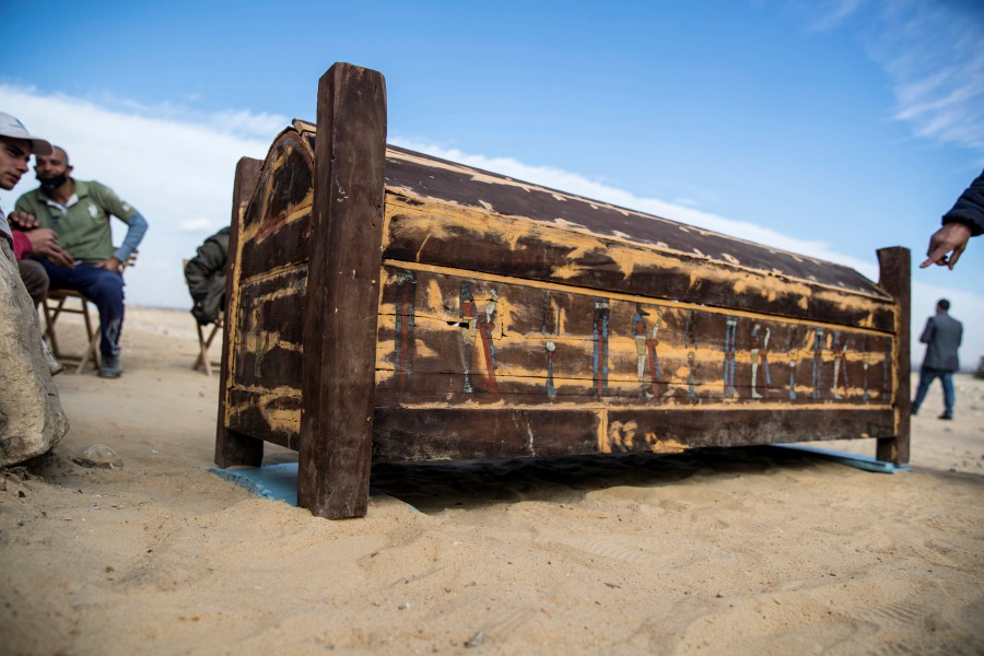 An adorned wooden sarcophagus is displayed during the official announcement of the discovery by an Egyptian archaeological mission of a new trove of treasures at Egypt's Saqqara necropolis south of Cairo, on January 17, 2021. - The discovery at the necropolis which lies 30kms south of the Egyptian capital, includes the funerary temple of Queen Naert, wife of King Teti, as well as burial shafts, coffins, and mummies dating back to the New Kingdom, dating back to more than 2500 years. (Photo by Khaled DESOUKI / AFP)