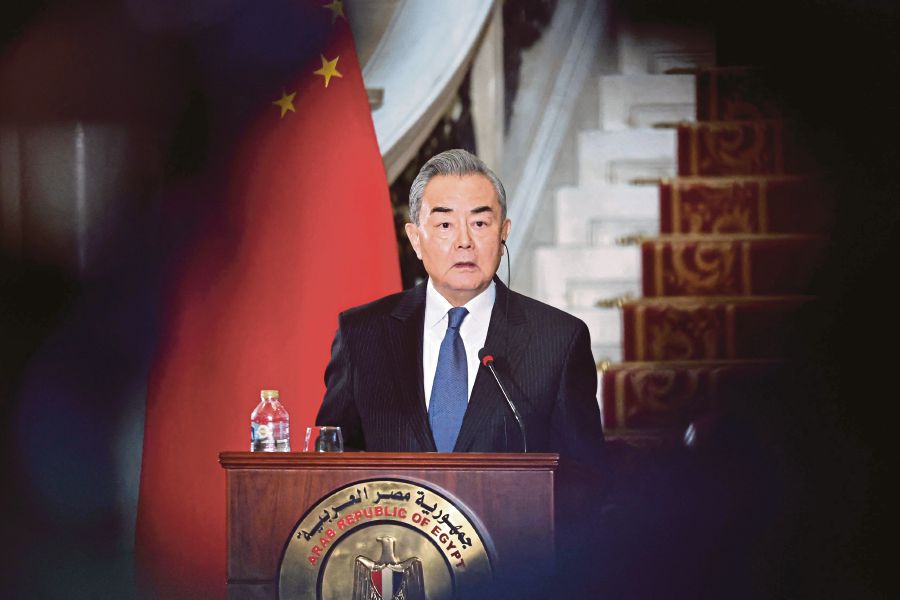 China's Foreign Minister Wang Yi speaks during a press conference with his Egyptian counterpart following a meeting at al-Tahrir Palace in the center of the Egyptian capital Cairo. (Photo by Khaled DESOUKI / AFP)