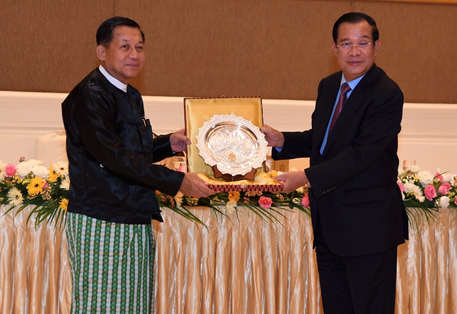 A handout photo made available by National Television of Cambodia (TVK) shows Cambodia Prime Minister Hun Sen (R) offers a souvenir to Myanmar Junta leader Min Aung Hlaing (L) during a diner in Naypyitaw, Myanmar, 07 January 2022 (issued 08 January 2022). Cambodia PM Hun Sen is on a two day official visit to Myanmar. - EPA pic