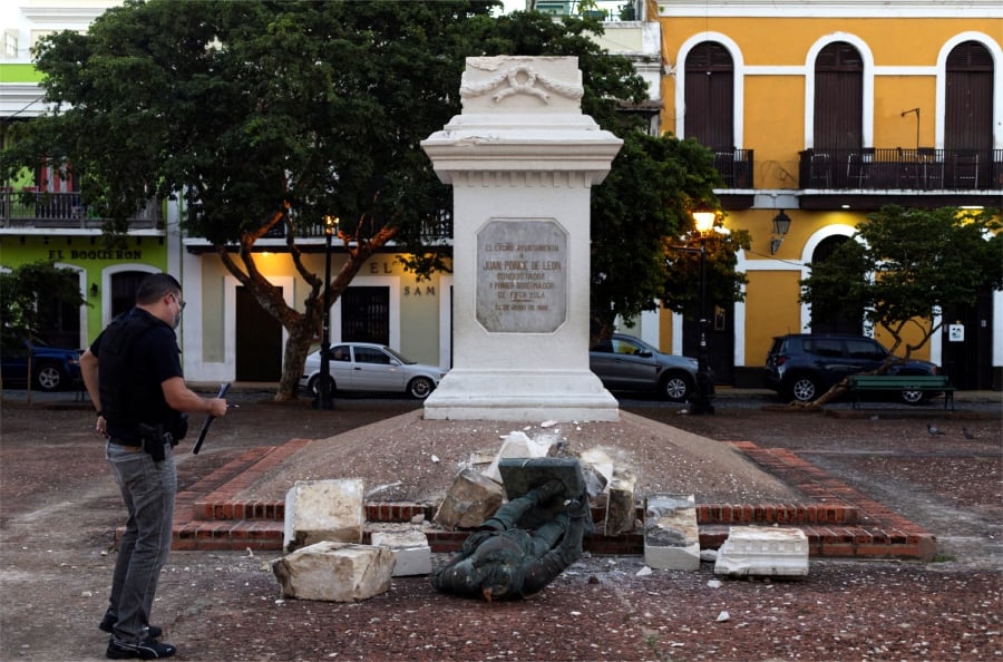 A downed statue of Juan Ponce de Leon, in the Plaza San Jose, in central San Juan, Puerto Rico. - EPA Pic