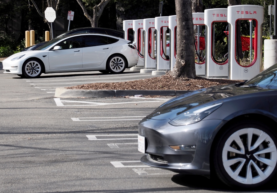 Tesla electric vehicles (EV) charge up their EVâ€™s at a Tesla Supercharger station in San Ramon, California, USA, 17 February 2023. - EPA Pic