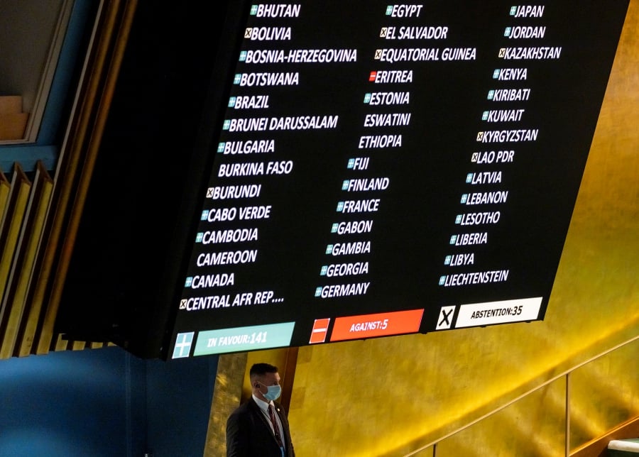 A UN police officer stands under a screen showing results from a vote on a resolution condemning Russiaâ€™s invasion of Ukraine during the 11th emergency special session of the United Nations General Assembly at United Nations headquarters in New York. - EPA Pic