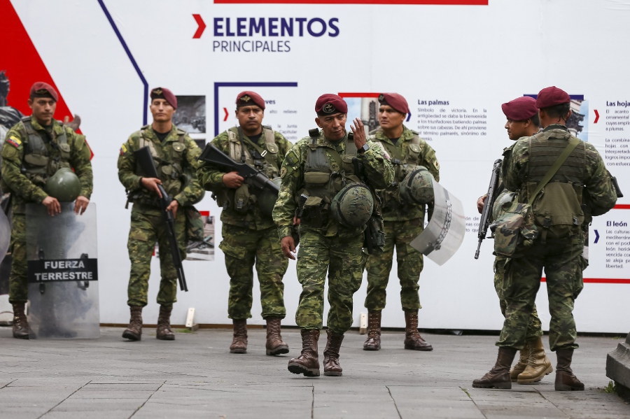 Ecuadorian soldiers patrol near the Government Palace in Quito, Ecuador. - EPA Pic