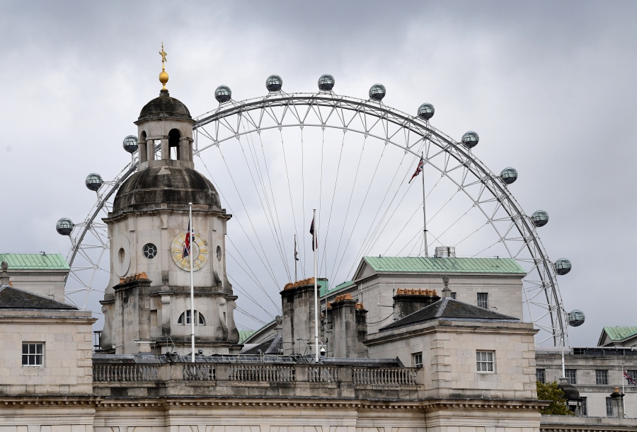 Rain clouds above the London Eye observation wheel, in London, Britain, 29 September 2020. - EPA