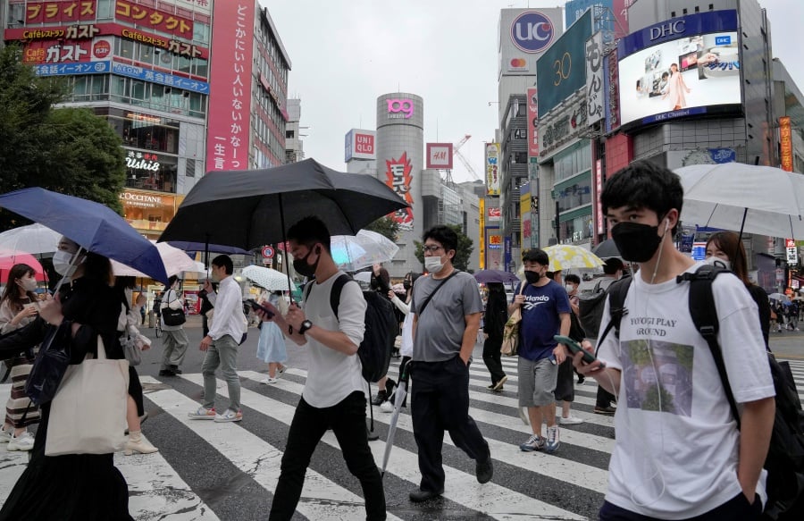 Pedestrians wearing protective masks walk a crossway at Shibuya in Tokyo, Japan. Tokyo has marked 77 new COVID-19 infection cases on 12 October 2021, the fourth straight day marking under 100 cases, after the Japanese government lifted the COVID-19 state of emergency in 19 prefectures including Tokyo on 01 October 2021. EPA pic