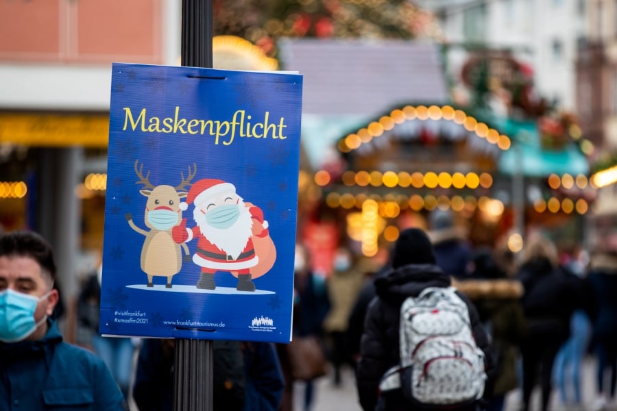  A sign reading, “Mask obligation!“ is placed at the Christmas market in Frankfurt, Germany. - EPA Pic