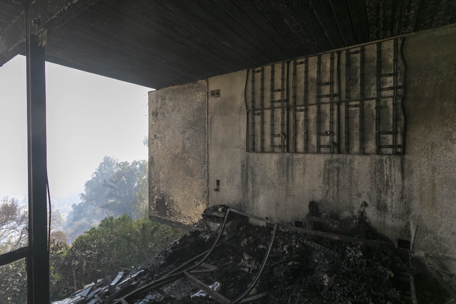Only charred debris remains after a house was burned in the Getty Fire on October 28, 2019 in Los Angeles, California. Reported at 1:30 a.m., the fire quickly burned 600 acres and several homes and forced evacuations in an area near the Getty Center. David McNew/Getty Images/AFP