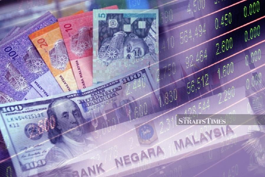 The ringgit eased further today to RM4.63 against the US dollar at 4pm. - File pic