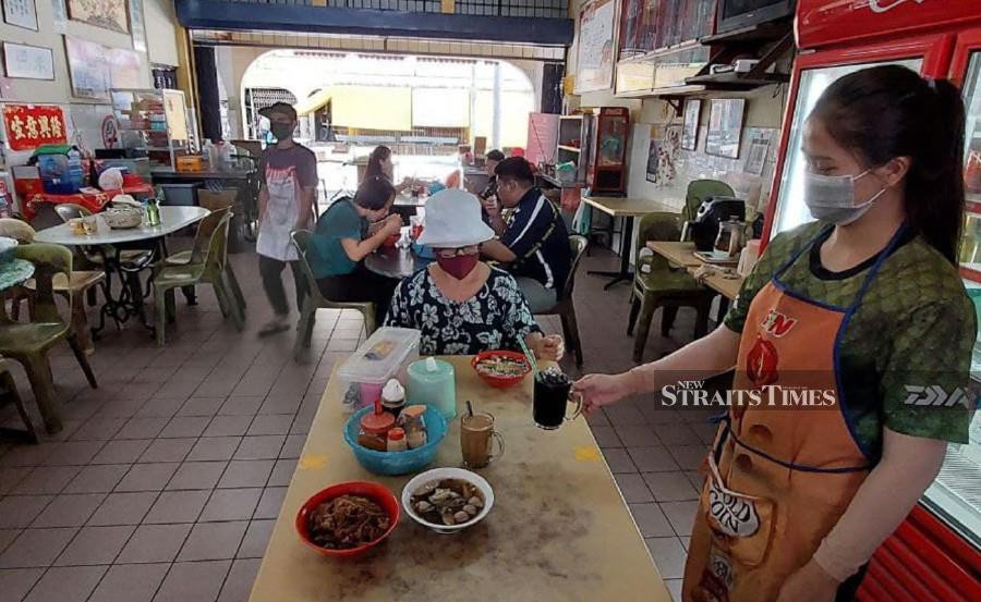 Eateries and coffee shop operators in Sabah have been fighting for survival since the Movement Control Order (MCO) was enforced last March. - NSTP/ PAUL MU