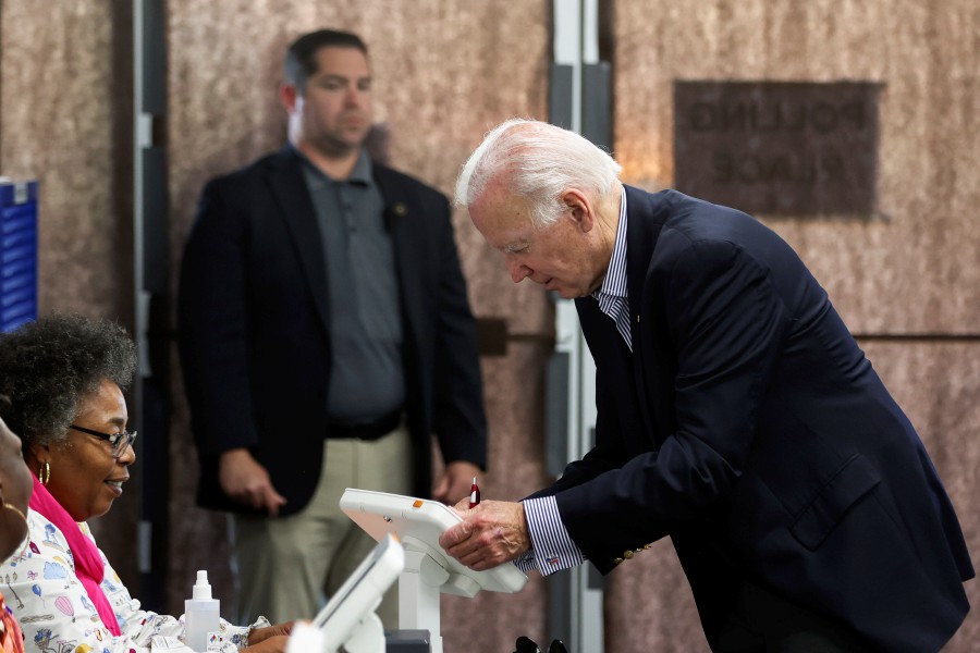 President Joe Biden prepares to cast his vote during early voting for the 2022 U.S. midterm elections at a polling station in Wilmington, Del. - AP pic