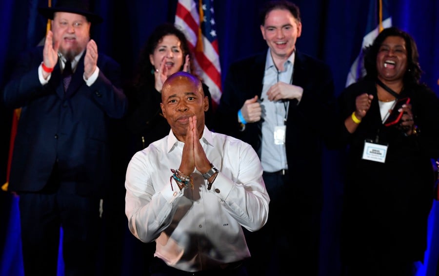 New York City Democratic Mayor-elect Eric Adams gestures to supporters during his 2021 election victory night party at the Brooklyn Marriott in New York City. - AFP PIC