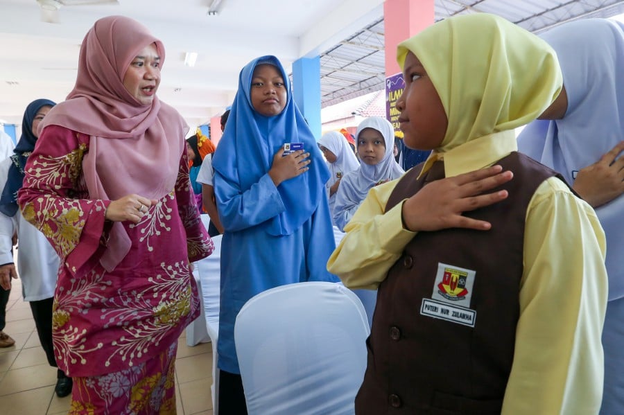 NIBONG TEBAL : Education Minister Fadhlina Sidek (Left) said the ministry was committed to ensuring equality by providing opportunities and creating an environment suitable for all children. — NSTP/DANIAL SAAD