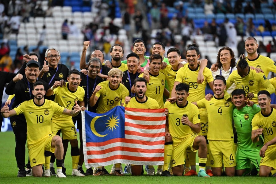 Malaysia's players and team members pose for a group photograph at the end of the Qatar 2023 AFC Asian Cup Group E football match between South Korea and Malaysia at Al-Janoub Stadium in al-Wakrah, south of Doha, on January 25, 2024. AFP PIC
