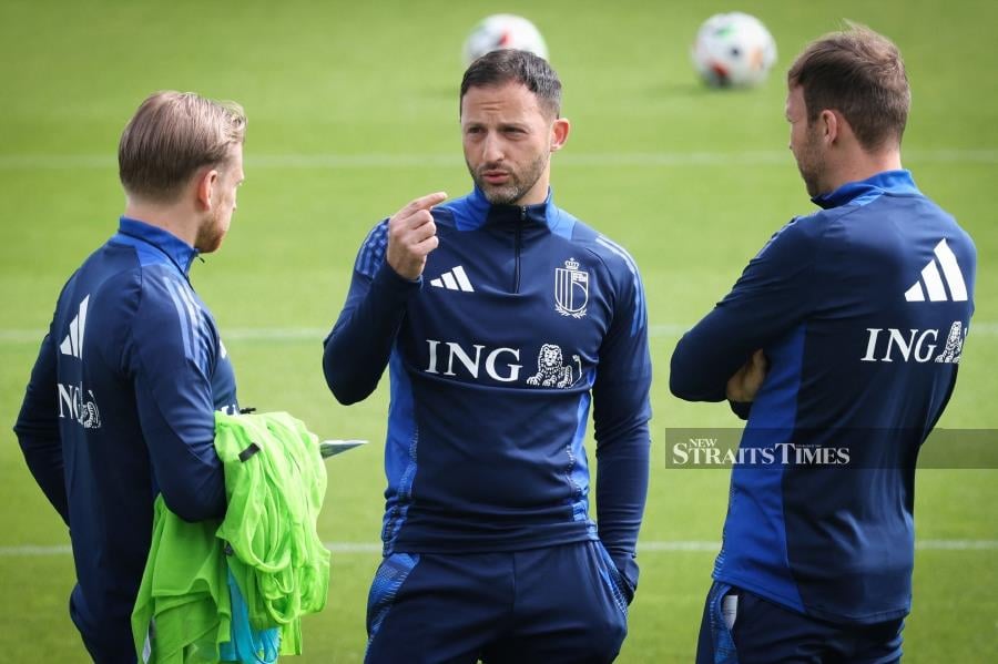 Belgium coach Domenico Tedesco (centre) gives instructions during a training session as part of the team's preparation for Euro 2024 at the Royal Belgian Football Association's training centrer in Tubize on Tuesday. AFP PIC