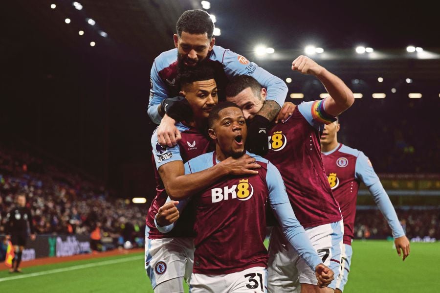 Aston Villa's Jamaican striker #31 Leon Bailey (C) celebrates with teammates after scoring the opening goal during the English Premier League football match between Aston Villa and Manchester City on December 6, 2023.- AFP pic
