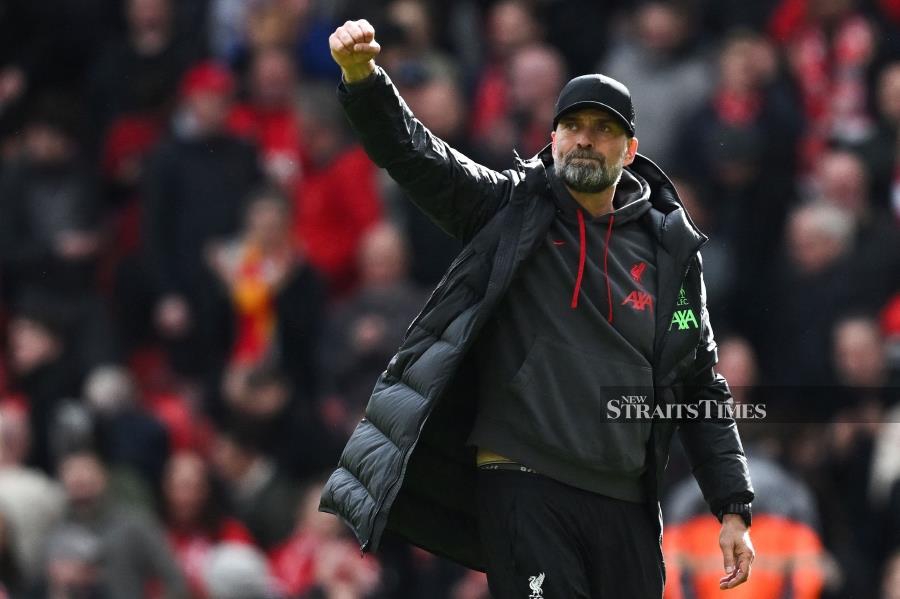 Liverpool’s Jurgen Klopp celebrates at the end of the Premier League match against Brighton at Anfield in Liverpool, north west England on Sunday. AFP PIC 