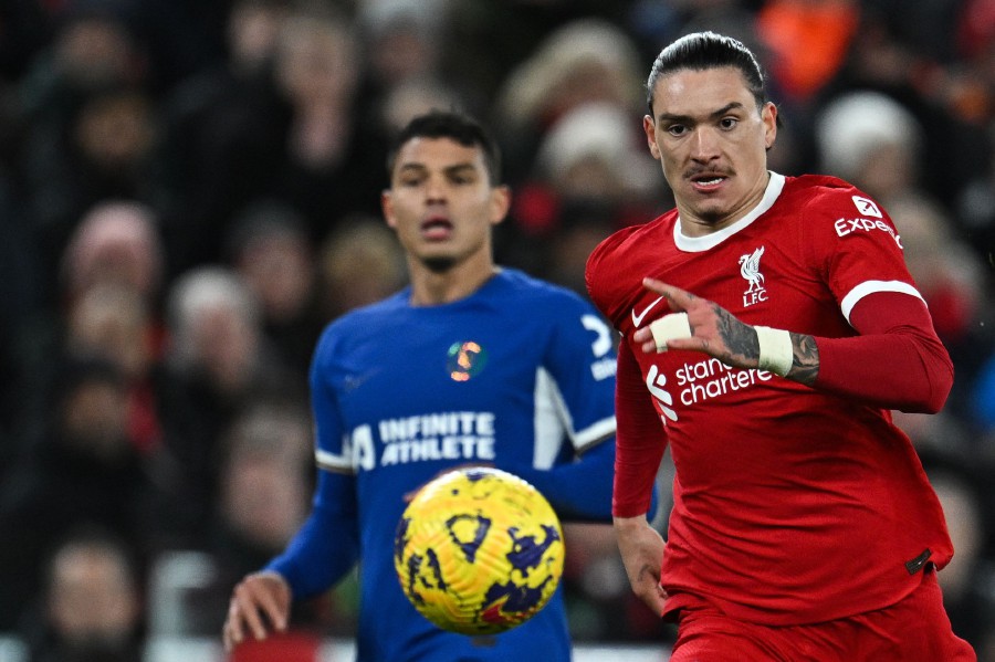 Liverpool's Uruguayan striker #09 Darwin Nunez (R) eyes the ball during the English Premier League football match between Liverpool and Chelsea at Anfield in Liverpool, north west England on January 31, 2024. AFP PIC