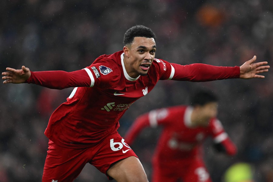 Liverpool's English defender #66 Trent Alexander-Arnold celebrates after scoring their fourth goal during the English Premier League football match between Liverpool and Fulham at Anfield in Liverpool, northwest England, on December 3, 2023. AFP PIC