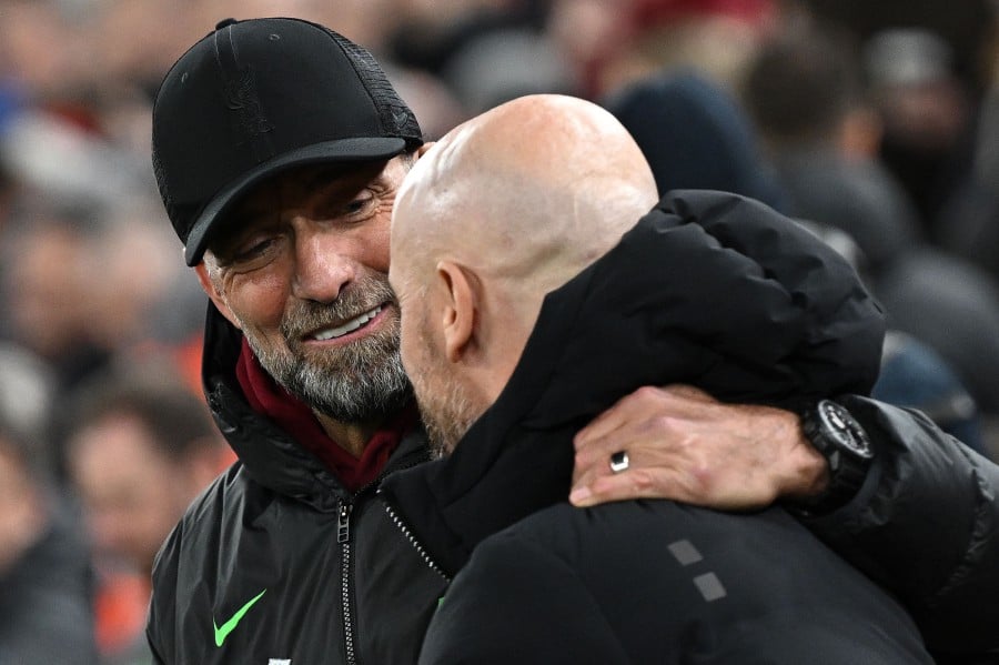 Liverpool's German manager Jurgen Klopp (L) greets Manchester United's Dutch manager Erik ten Hag ahead of the English Premier League football match between Liverpool and Manchester United at Anfield in Liverpool, north west England on December 17, 2023. AFP PIC