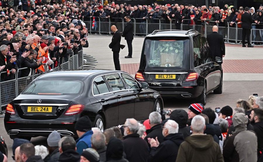 Mourners pay their respects as a hearse carrying the coffin of England World Cup winner and Manchester United legend Bobby Charlton is driven past Old Trafford stadium ahead of his funeral in Manchester, northern England. Charlton, described by Manchester United as a "giant of the game", died on October 21, 2023 at the age of 86. - AFP pic