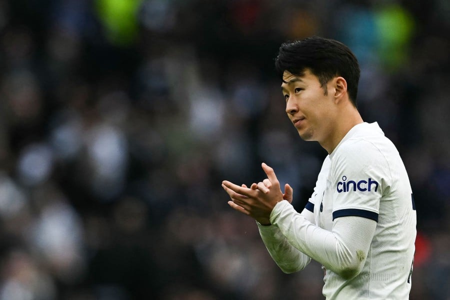 Tottenham Hotspur's South Korean striker #07 Son Heung-Min applauds at the end of the English Premier League football match between Tottenham Hotspur and Luton Town at the Tottenham Hotspur Stadium in London, on March 30, 2024. Tottenham Hotspur wins 2 - 1 against Luton Town. AFP PIC