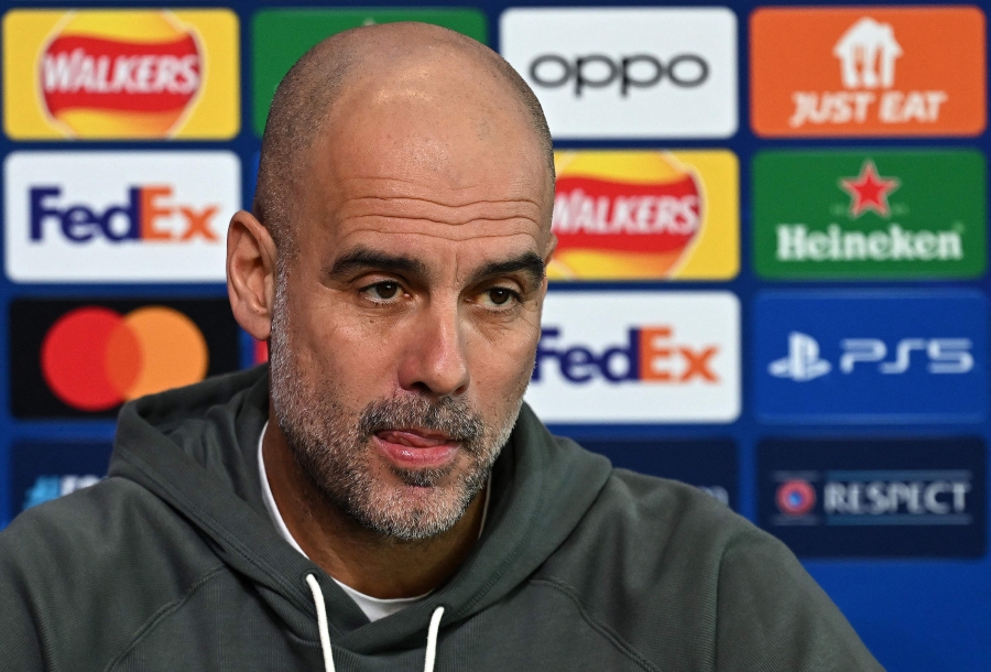 Manchester City's Spanish manager Pep Guardiola attends a press conference at Manchester City's training ground in north-west England, on the eve of their UEFA Champions League Group round of 16 second-leg football match against FC Copenhagen. (Photo by Paul ELLIS / AFP)