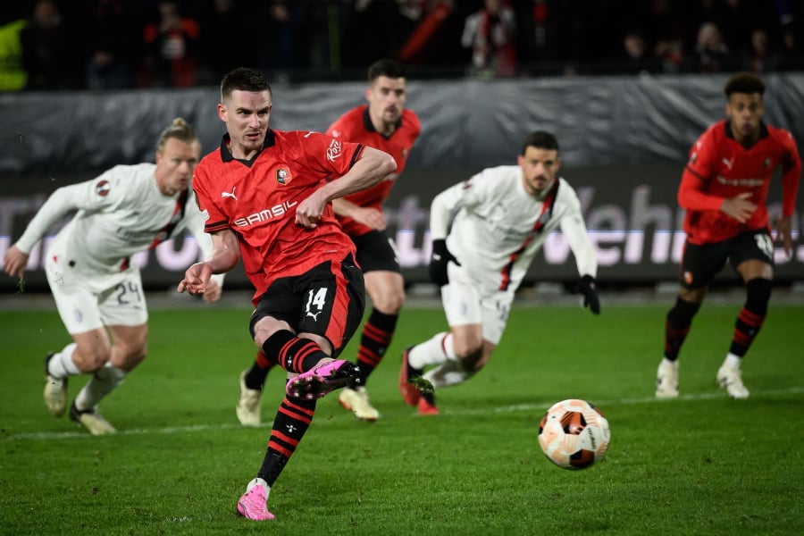 Rennes' French midfielder Benjamin Bourigeaud shoots from the penalty spot to score his team's second goal during the UEFA Europa League round of 16 play-off match between Rennes and AC Milan at The Roazhon Park Stadium in Rennes. AFP