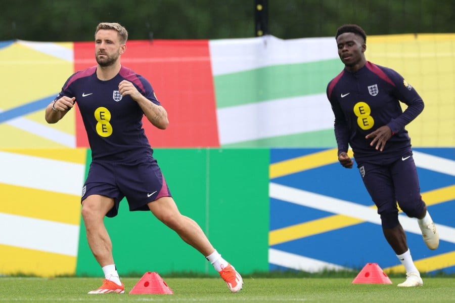 England's defender #03 Luke Shaw (L) and England's forward #07 Bukayo Saka take part in a training session at the team's base camp in Blankenhain, Thuringia, on June 27, 2024 during the UEFA Euro 2024 European Football Championship. AFP PIC