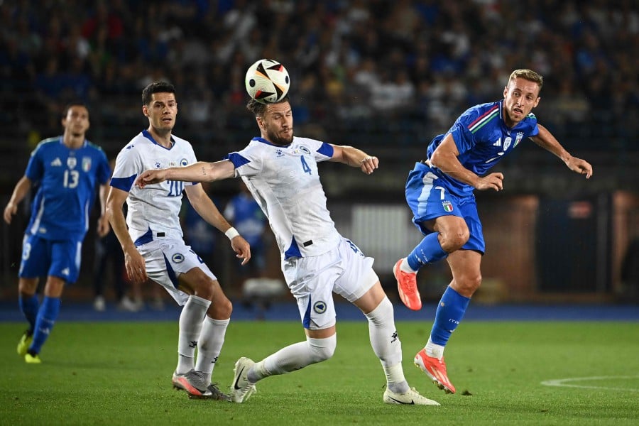 Italy's midfielder #07 Davide Frattesi fights for the ball with Bosnia-Herzegovina's defender #04 Ermin Bicakcic during the International friendly football match between Italy and Bosnia-Herzegovina in Empoli on June 09, 2024. AFP PIC