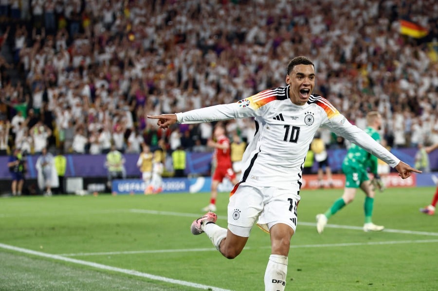 Germany's midfielder #10 Jamal Musiala celebrates scoring his team's second goal during the UEFA Euro 2024 round of 16 football match between Germany and Denmark at the BVB Stadion Dortmund in Dortmund on June 29, 2024. AFP PIC