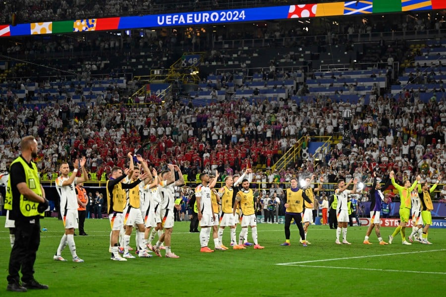 Germany's players applaud the fans at the end of the UEFA Euro 2024 round of 16 football match between Germany and Denmark at the BVB Stadion Dortmund in Dortmund on June 29, 2024. AFP PIC